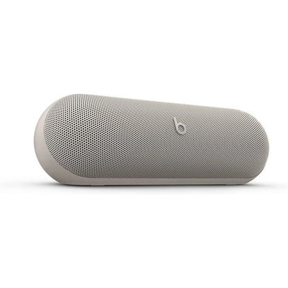 Beige portable speaker with Beats logo on a white background
