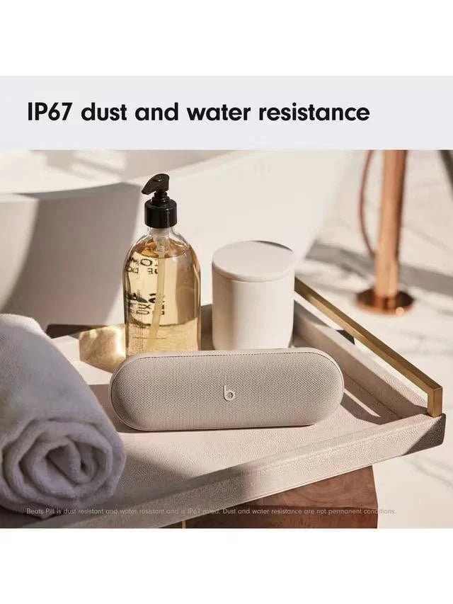 Smart home device on a table with a bottle and towel, featuring IP67 dust and water resistance text.